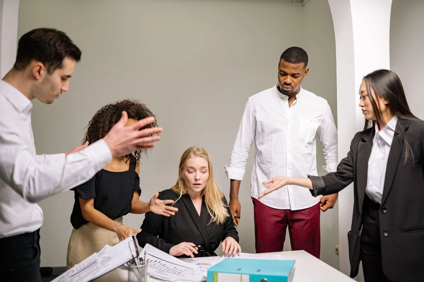 Colleagues discussing project plans together in an office